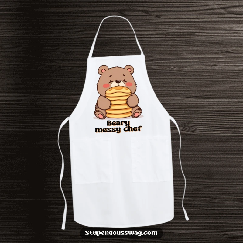 An apron showcasing a clumsy bear trying to balance pancakes, ensuring kitchen protection with a side of morning humor.