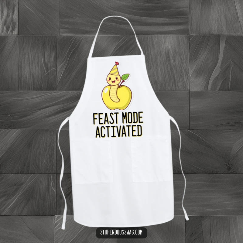 Funny apron featuring a happy worm in a party hat wiggling out of an apple, ideal for culinary celebrations.