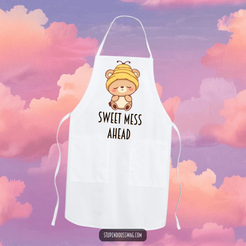 Funny apron featuring a sleepy bear character comically wearing a beehive as a hat while perhaps baking.