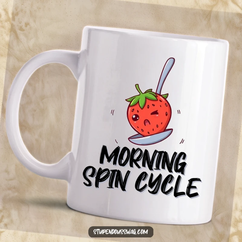 Funny mug showing a bewildered strawberry spinning rapidly on an upside-down spoon, capturing a moment of delightful, dizzying fruit fun.