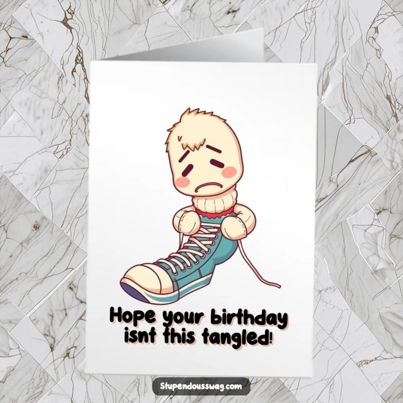 Funny Free Printable Birthday Card: A bewildered sock puppet hopelessly tangled while attempting to tie its own shoelaces, embodying birthday chaos.