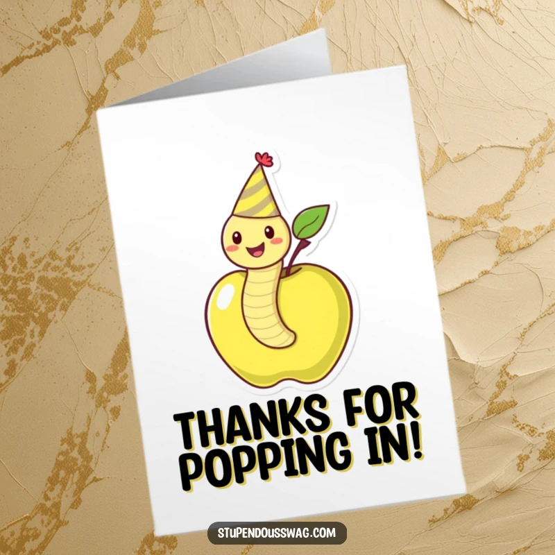 Funny Free Printable Thank You Card: A happy, party-hat-wearing worm emerges from an apple, offering a whimsical thank you.