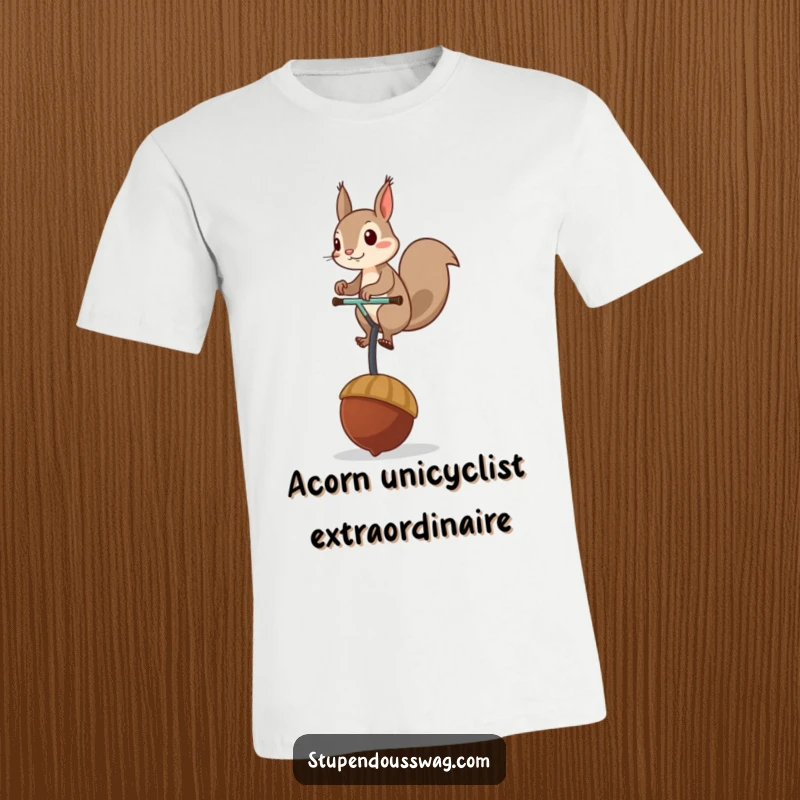 Funny t-shirt depicting a mischievous squirrel balancing on a giant acorn used as a unicycle, showcasing charming and comical activity.