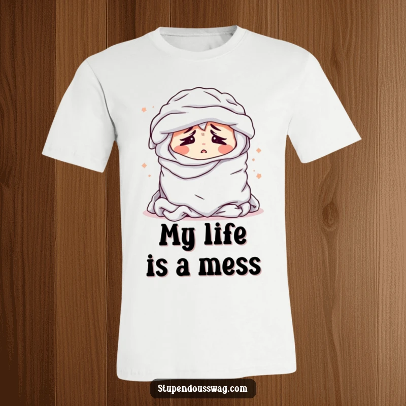 Funny t-shirt with a bewildered pile of laundry sighing dramatically, a humorous depiction of household chore struggles.
