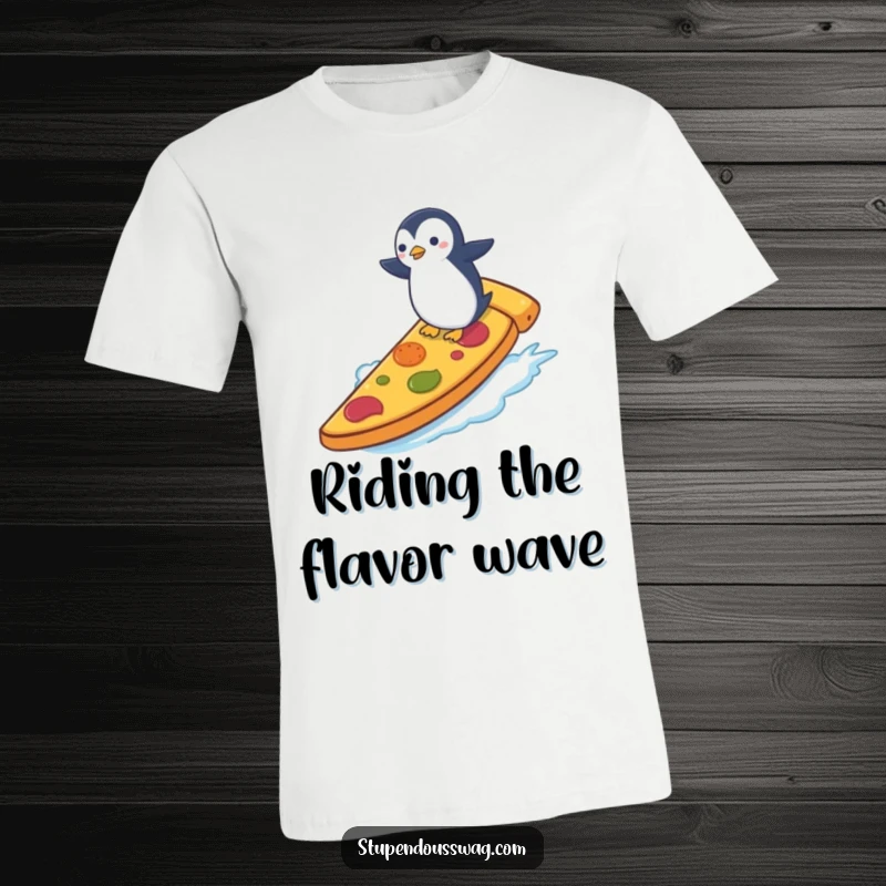 Funny T-shirt showing a tiny penguin attempting to surf on a massive slice of pizza, capturing a moment of hilarious, daring adventure.