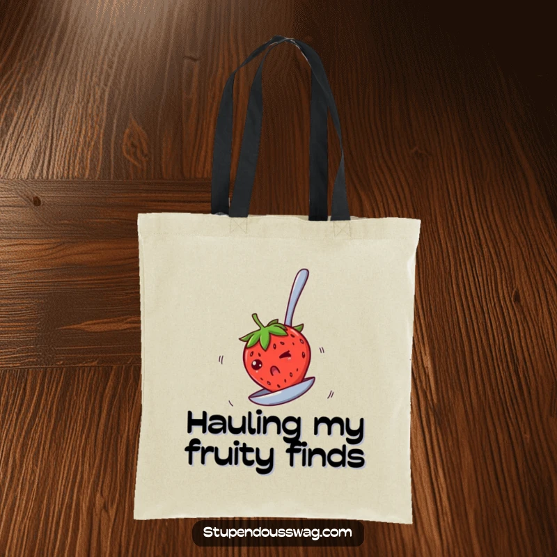 Funny tote bag with a bewildered strawberry spinning rapidly on an upside-down spoon, perfect for carrying essentials with a humorous, dizzying flair.